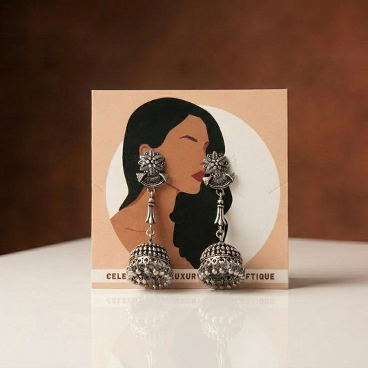 A graceful expression of tradition, the Noorika Jhumka captures the beauty of classic artistry with a soft, elegant glow. Its intricate detailing and timeless silhouette bring a rich cultural charm that feels both regal and effortlessly graceful.