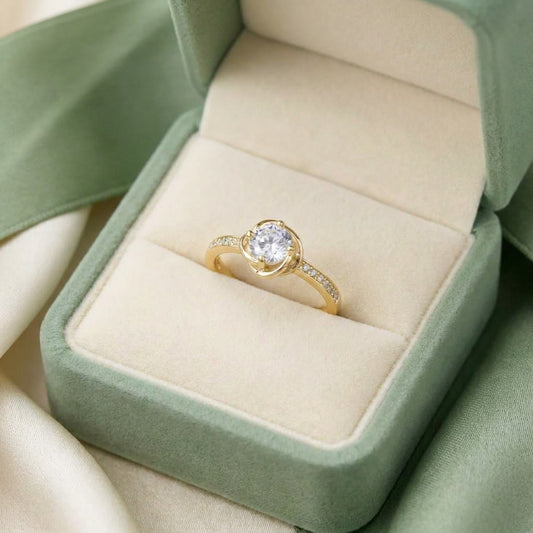 A delicate sparkle wrapped in graceful curves, Orlina Ring brings a soft elegance with its brilliant center stone embraced by flowing lines. Refined and timeless, it feels like a little piece of light resting on your hand.