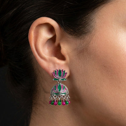 A vibrant celebration of tradition and color, this piece captures the charm of lotus-inspired elegance with a playful festive touch. The blooming motif paired with lively red and green bead drops creates a graceful movement that feels joyful, eye-catching, and beautifully rooted in culture.