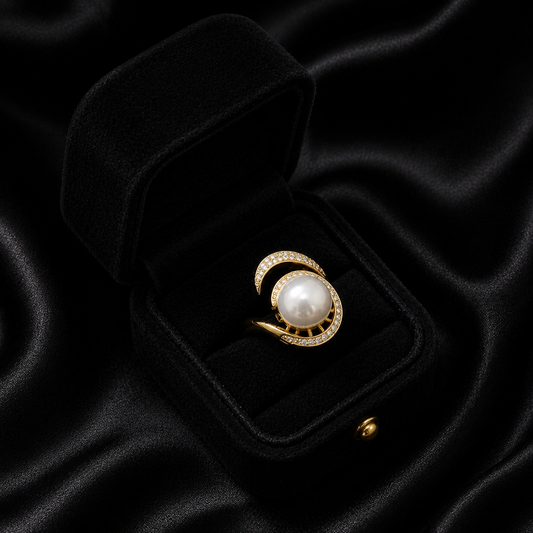 Channel your inner queen with the Pave Empress Ring, a piece that commands attention with its majestic presence. This ring features a brilliant artificial pearl encircled by a halo of light, creating a regal silhouette that is both powerful and breathtakingly feminine.