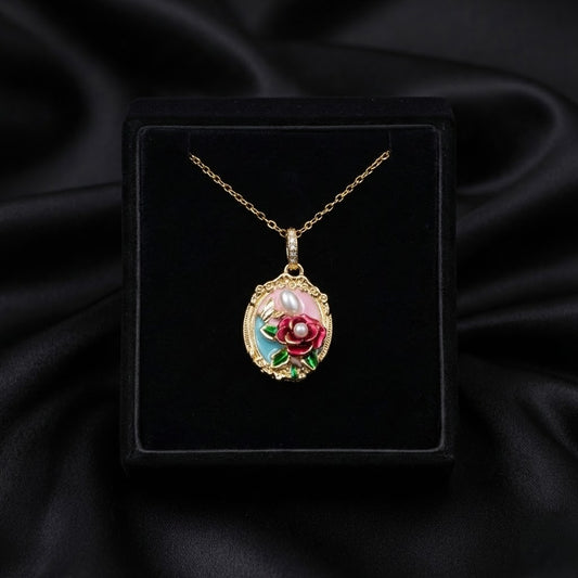 A tiny blooming garden captured in enamel and pearl Pearl Garden Pendant brings a soft floral charm to your everyday style. The delicate flower motifs and pearl accents create a graceful, nature-inspired look that feels both elegant and playful.