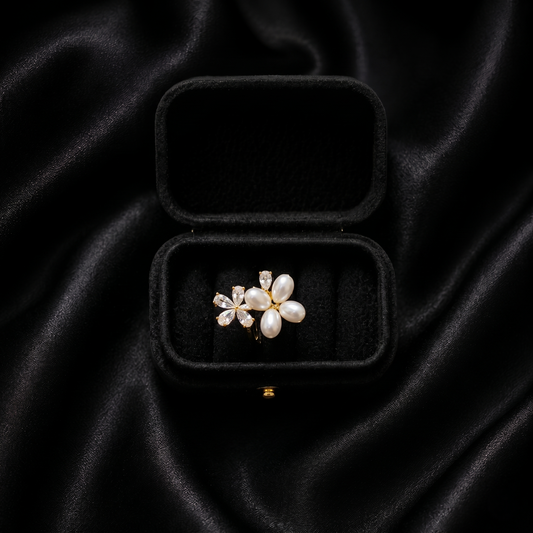 Let your style take flight with a piece that captures the delicate beauty of a garden in spring. The Pearl Papillon Ring features a breathtaking butterfly-inspired floral design, blending the soft luster of pearls with a high-fashion golden glow. It’s a whimsical yet sophisticated statement piece that adds a touch of ethereal charm to any outfit.