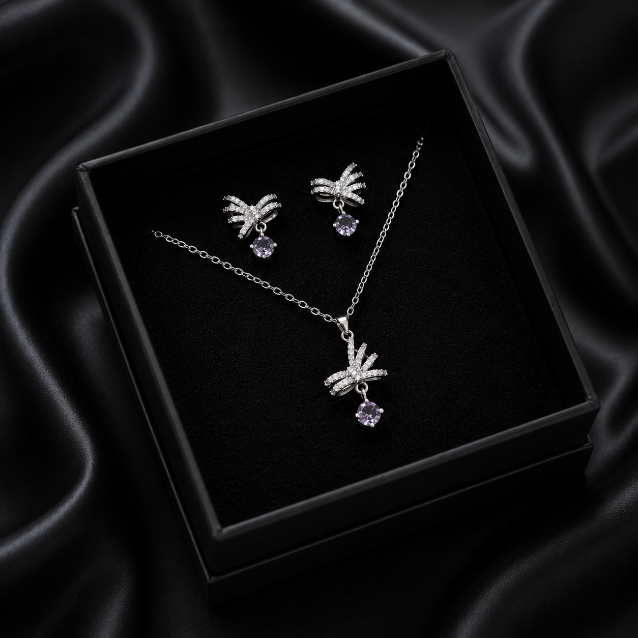 Let your style take flight with the Radiant Zephyr Set, a whimsical collection that captures the delicate beauty of a butterfly in motion. Inspired by classical bow motifs, this set blends feminine charm with a high-fashion, ethereal feeling, making it the perfect choice for those who love jewelry with a story.