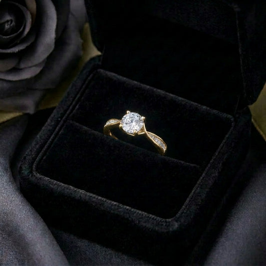 A graceful flow captured in delicate curves, Rivelle Flowelle Ring blends timeless sparkle with a soft wave silhouette. The flowing band embraces the brilliant center stone beautifully, creating an elegant piece that feels refined, romantic, and effortlessly wearable.