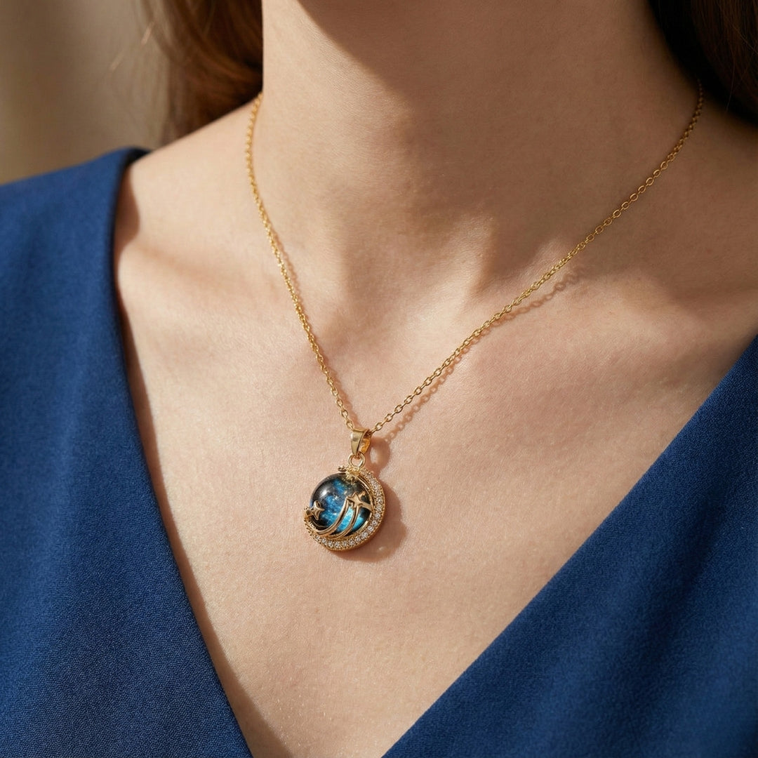 Unveil the elegance of the cosmos with the Stardust Whisper Necklace, a breathtaking creation crafted from premium titanium steel and plated with a durable titanium finish. This necklace features a mesmerizing cosmic-inspired pendant, adorned with glimmering zircon stones that catch the light from every angle.