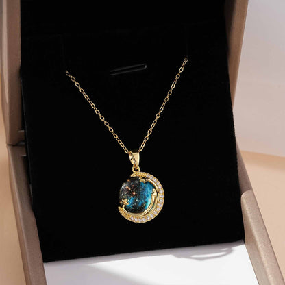 Unveil the elegance of the cosmos with the Stardust Whisper Necklace, a breathtaking creation crafted from premium titanium steel and plated with a durable titanium finish. This necklace features a mesmerizing cosmic-inspired pendant, adorned with glimmering zircon stones that catch the light from every angle.