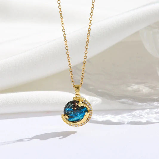 Unveil the elegance of the cosmos with the Stardust Whisper Necklace, a breathtaking creation crafted from premium titanium steel and plated with a durable titanium finish. This necklace features a mesmerizing cosmic-inspired pendant, adorned with glimmering zircon stones that catch the light from every angle.