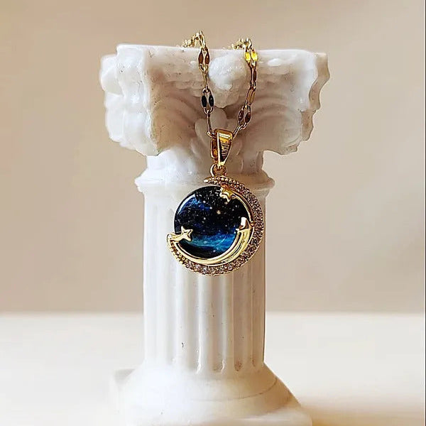 Unveil the elegance of the cosmos with the Stardust Whisper Necklace, a breathtaking creation crafted from premium titanium steel and plated with a durable titanium finish. This necklace features a mesmerizing cosmic-inspired pendant, adorned with glimmering zircon stones that catch the light from every angle.