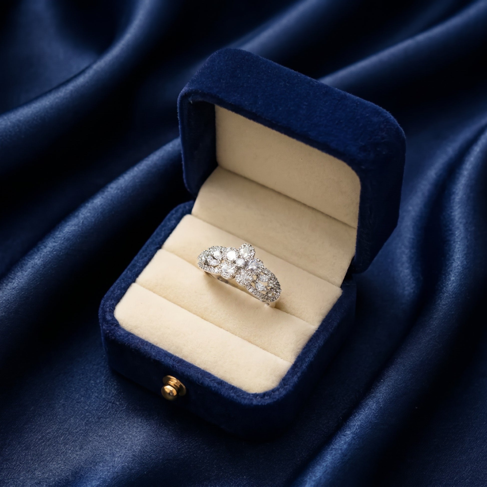 Like delicate starlight woven into an elegant lace pattern, this radiant ring captures a graceful blend of sparkle, artistry, and timeless feminine charm. Featuring clustered crystal blooms paired with intricate openwork detailing, it creates a refined statement that feels enchanting, sophisticated, and effortlessly luxurious.