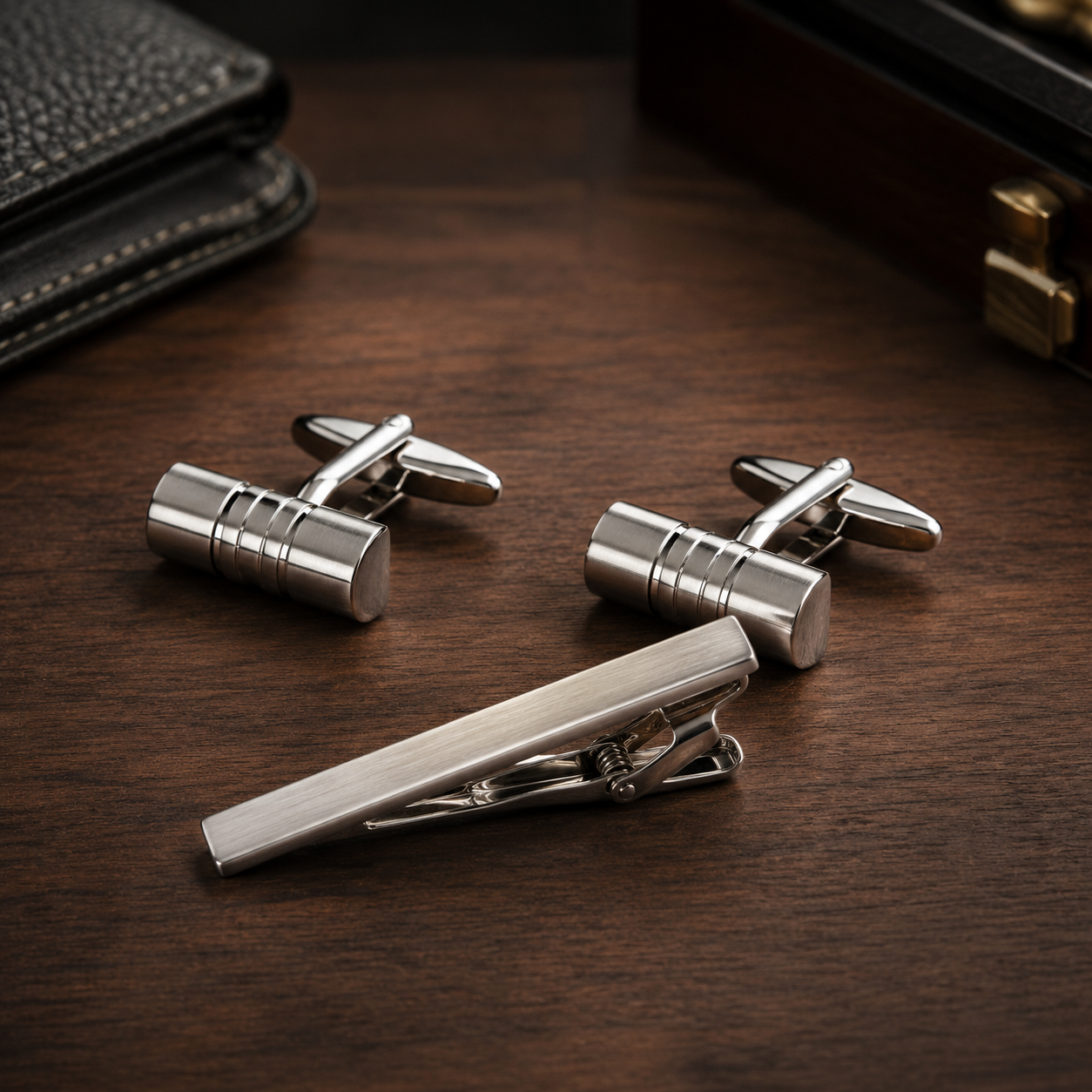 A sleek combination of modern sophistication and timeless formal styling, this matching tie clip and cufflink set is designed to bring a polished finishing touch to every outfit. With its clean metallic structure and minimal industrial detailing, the set delivers a sharp, confident look that feels effortlessly refined.