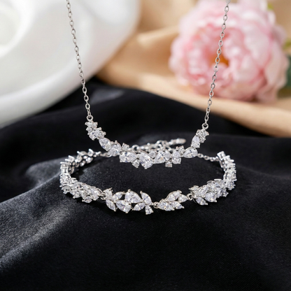 Graceful as falling petals in spring light, the Wisteria Petal Set glistens with pure sophistication. Each zircon stone is delicately cut and arranged in a floral flow, forming a soft cascade of brilliance that mirrors nature’s poetry. Crafted with premium zircon and finished with precision.