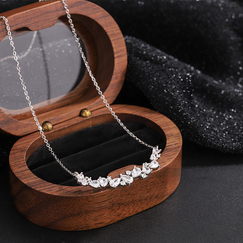 Graceful as falling petals in spring light, the Wisteria Petal Set glistens with pure sophistication. Each zircon stone is delicately cut and arranged in a floral flow, forming a soft cascade of brilliance that mirrors nature’s poetry. Crafted with premium zircon and finished with precision.