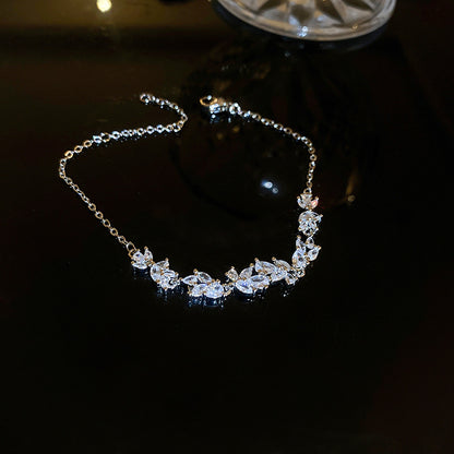 Graceful as falling petals in spring light, the Wisteria Petal Set glistens with pure sophistication. Each zircon stone is delicately cut and arranged in a floral flow, forming a soft cascade of brilliance that mirrors nature’s poetry. Crafted with premium zircon and finished with precision.