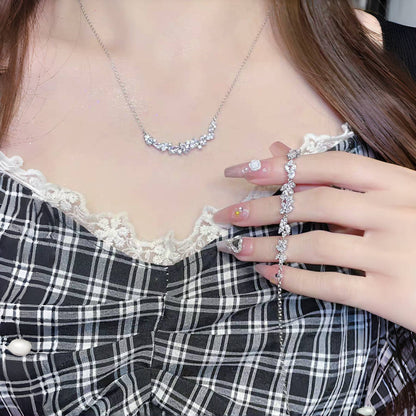 Graceful as falling petals in spring light, the Wisteria Petal Set glistens with pure sophistication. Each zircon stone is delicately cut and arranged in a floral flow, forming a soft cascade of brilliance that mirrors nature’s poetry. Crafted with premium zircon and finished with precision.